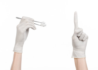 doctor's hand holding tweezers with swab isolated studio