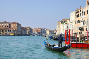 Fototapeta na wymiar Gondolier at Grand Canal, Venice, Italy and sunny day