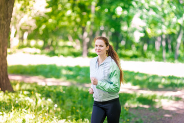 Fit sportive women jogging in the park