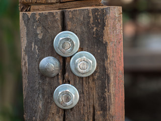 Nuts and bolt fasten in wood pole