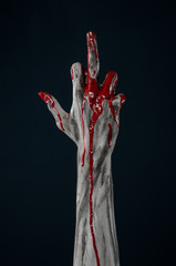 horrible zombie demon bloody hands on a black background