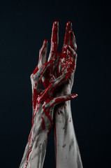 horrible zombie demon bloody hands on a black background