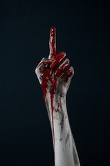 horrible zombie demon bloody hands on a black background