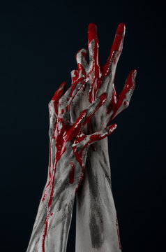 horrible zombie demon bloody hands on a black background