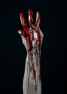 horrible zombie demon bloody hands on a black background
