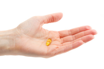 Omega 3 pill in the palm