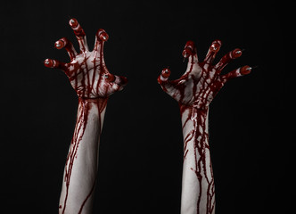 Bloody hand with syringe on the fingers, toes syringes in studio