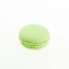 green macaron on white background