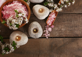Beautiful spa composition with spring flowers on wooden background