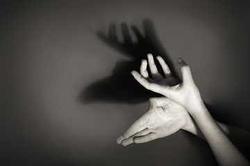 Hands gesture like deer on gray background