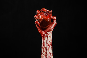 terrible bloody hand hold torn bleeding human heart isolated