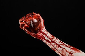 terrible bloody hand hold torn bleeding human heart isolated