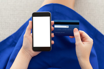 woman holding a phone with isolated screen and credit card