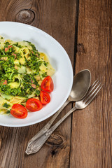 Spaghetti with spinach and bacon.