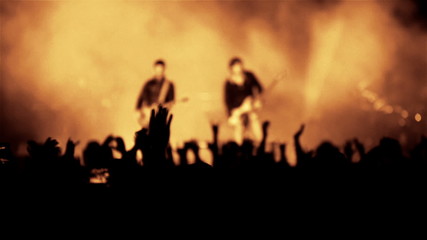 Rock guitarist band on open air live music show cheering crowd - Powered by Adobe