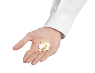 doctor's hand holding a white tablet for health  isolated