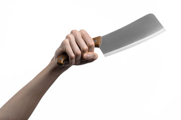 Hand holding a knife for meat, chef holding a kitchen knife