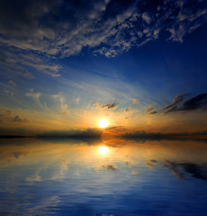 Fototapeta premium sunset over water surface