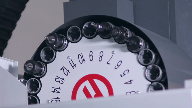 Automatic tool changer rotating bits with tools at CNC