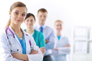 Woman doctor standing with stethoscope at hospital