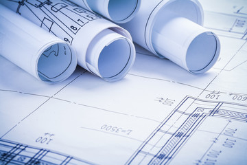 very close up view on rolled blueprints 