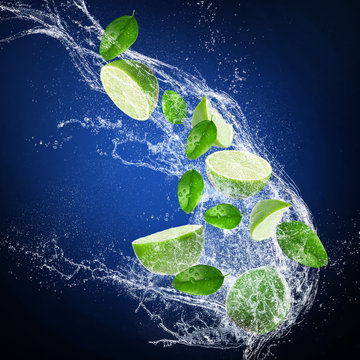 Ripe limes with water splash