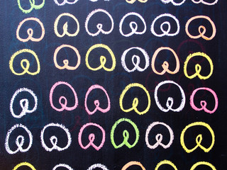 Colorfull pretzel drawing on a chalk board