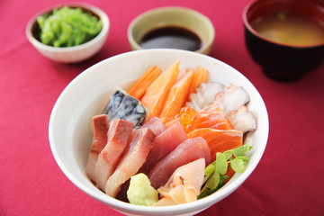 Sushi don , raw salmon tuna octopus on rice