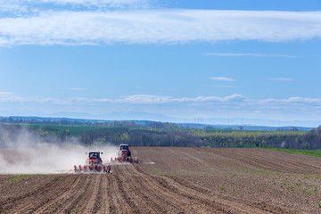 Tractor harrowing the field