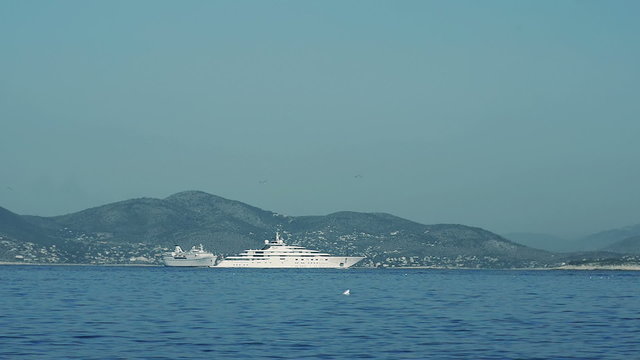 View of the luxury boat on the background of the island