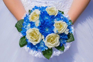 the bride's photo in a white dress with a wedding bouquet in her