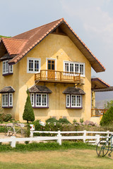 Beautiful yellow stone house in the tourist town Pai, Thailand