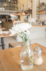 White flower decorated on wooden table