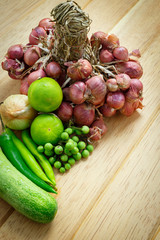 Huge group of fresh vegetables and fruit on wooden background