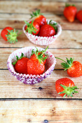 Fresh strawberries in paper cake pans