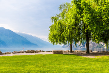 Fototapeta na wymiar Empty bench at the Lake of Garda, italy