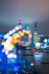 Blurred city lights and office buildings