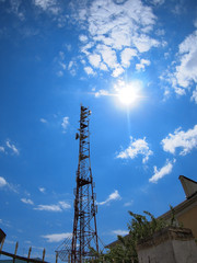 Obraz premium Tower of cellular communication against the blue sky