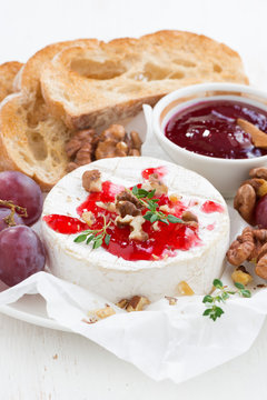 camembert with berry jam and toasts, vertical