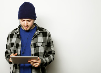 handsome young man working on digital tablet 