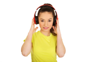 Young woman with headphones listening to music.