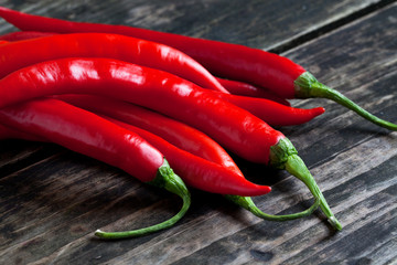 Red chili pepper on the wooden desk