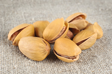 Pistachio nuts on a light background