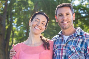 Obraz premium Happy couple smilling in park
