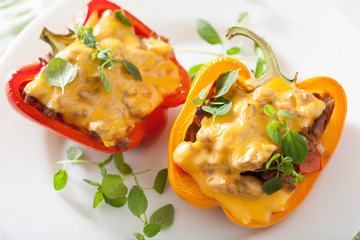 stuffed colorful peppers with meat cheese vegetables