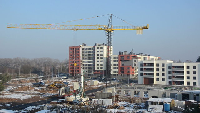 Crane lift block. Flat house apartment construction site works