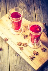 Vintage photo of glasses with mulled wine