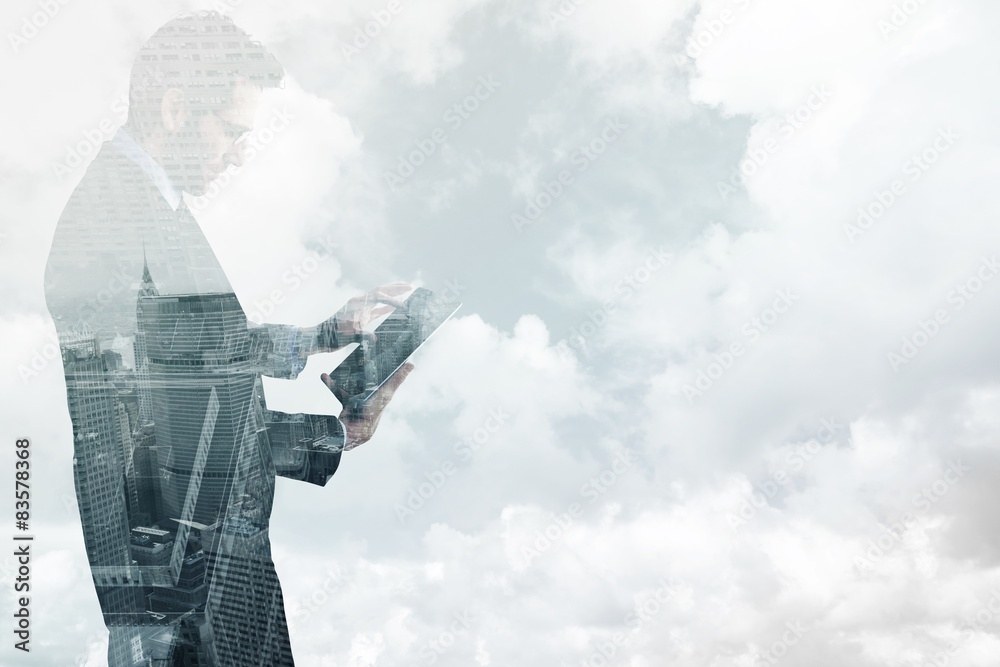 Aufkleber Composite image of businessman standing while using a tablet pc