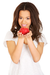 Beautiful woman holding an apple.