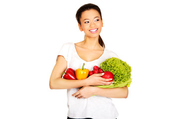 Young woman with vegetables.